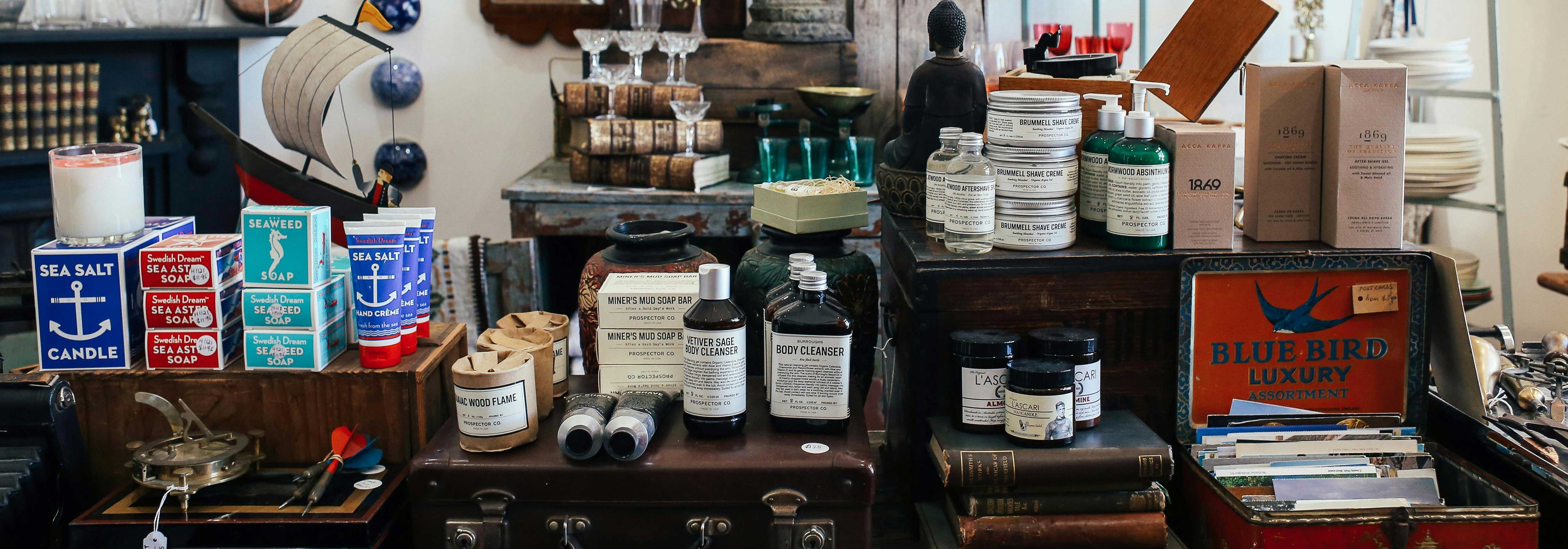 A softly lit bathroom shelf with curated natural skincare — Söstter's edit of independent vegan and B Corp-certified cosmetics from small founder-run makers.