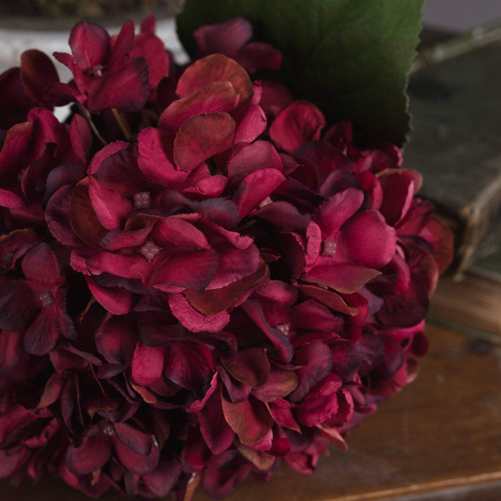 Lifelike ruby red hydrangea stem with hand-painted petals, 42cm tall, realistic plastic texture for home decor by Sostter at brixbailey.com