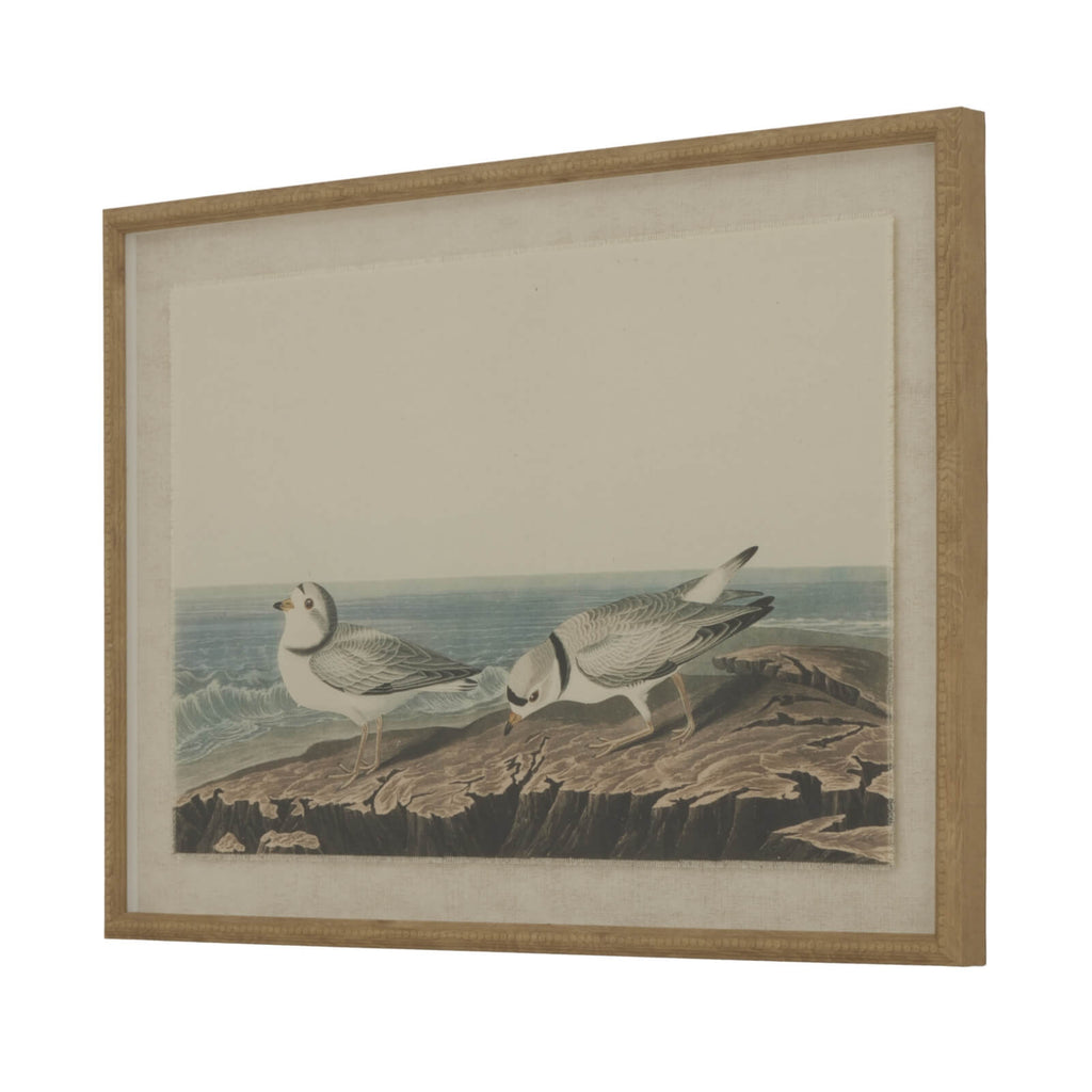 Handcrafted linen wall art with shorebird design, earthy brown tones, and ornate beaded border for coastal-inspired decor. by sostter at brixbailey.com