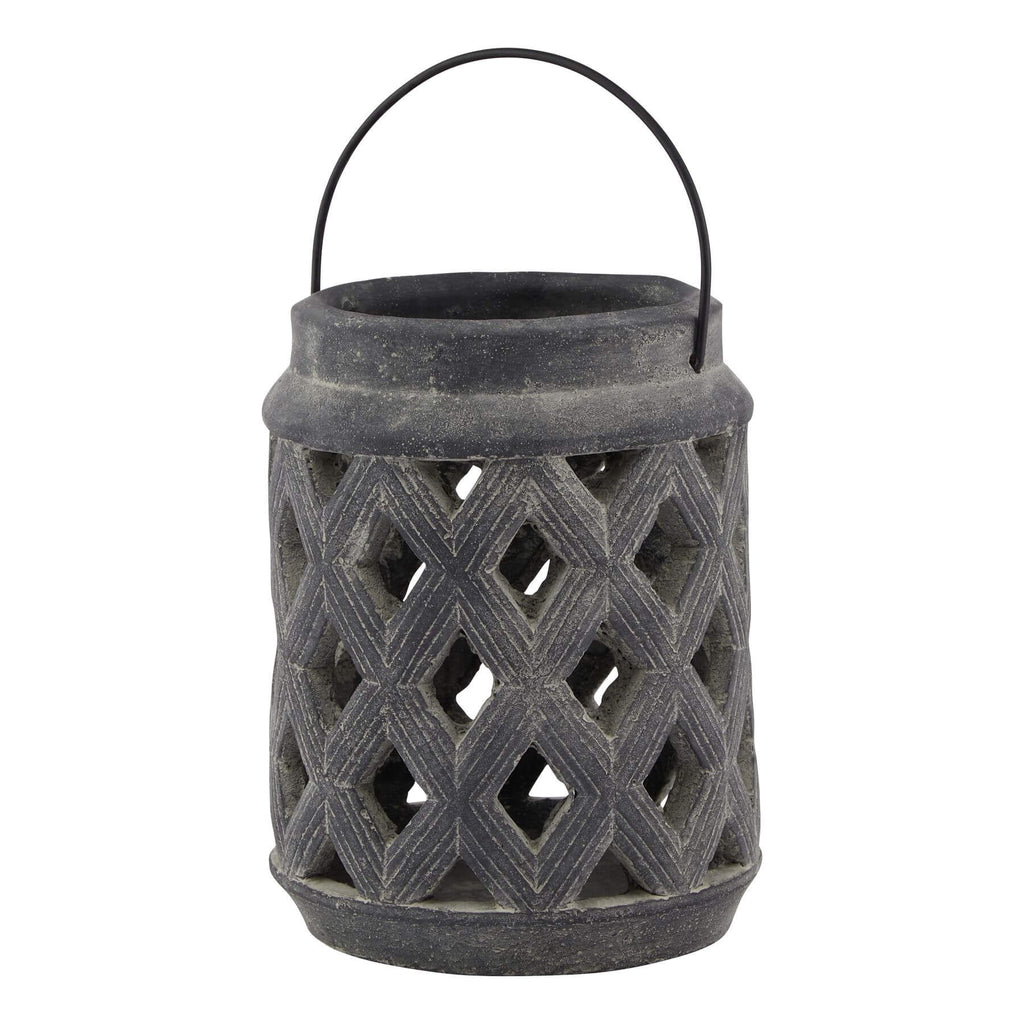 Grey lattice lantern with ceramic base and metal detailing, casting geometric shadow patterns in sophisticated grey finish. by Sostter at brixbailey.com