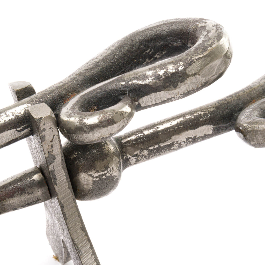 Antique pewter crook-handled hearth tidy with lustrous metallic finish, perfect for fireplace ash cleanup and elegant decor. by sostter at brixbailey.com