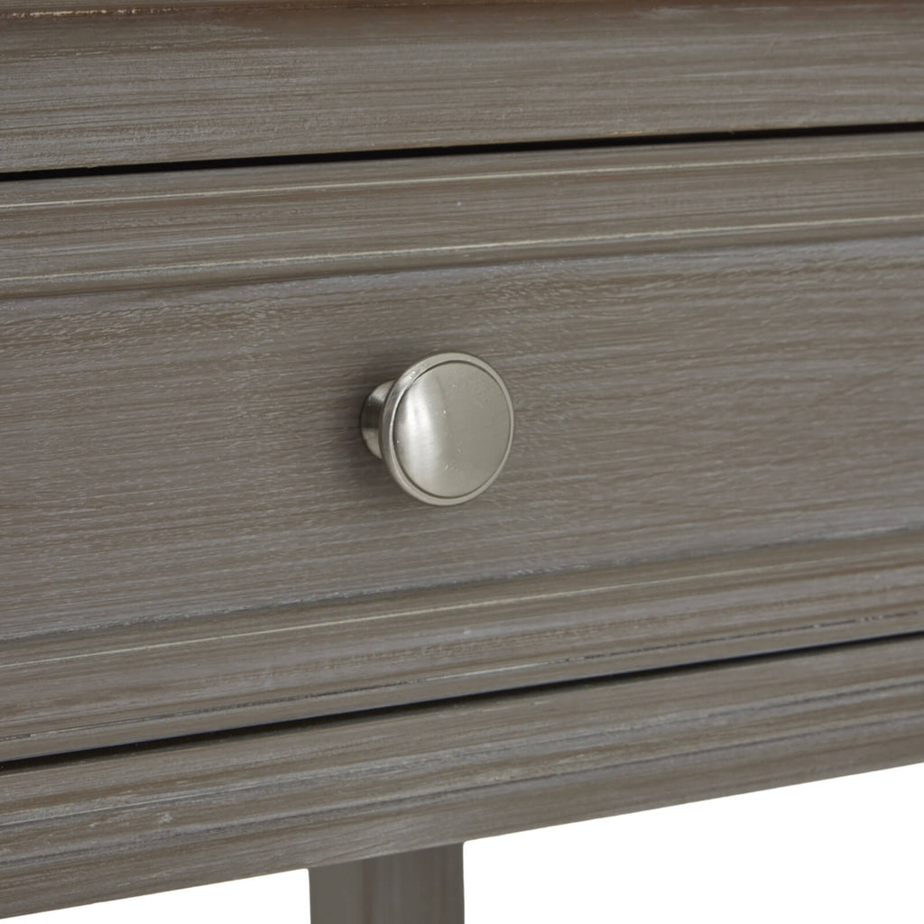 Distressed grey four-drawer console table with solid wood construction and transitional design for living room storage. by Sostter at brixbailey.com