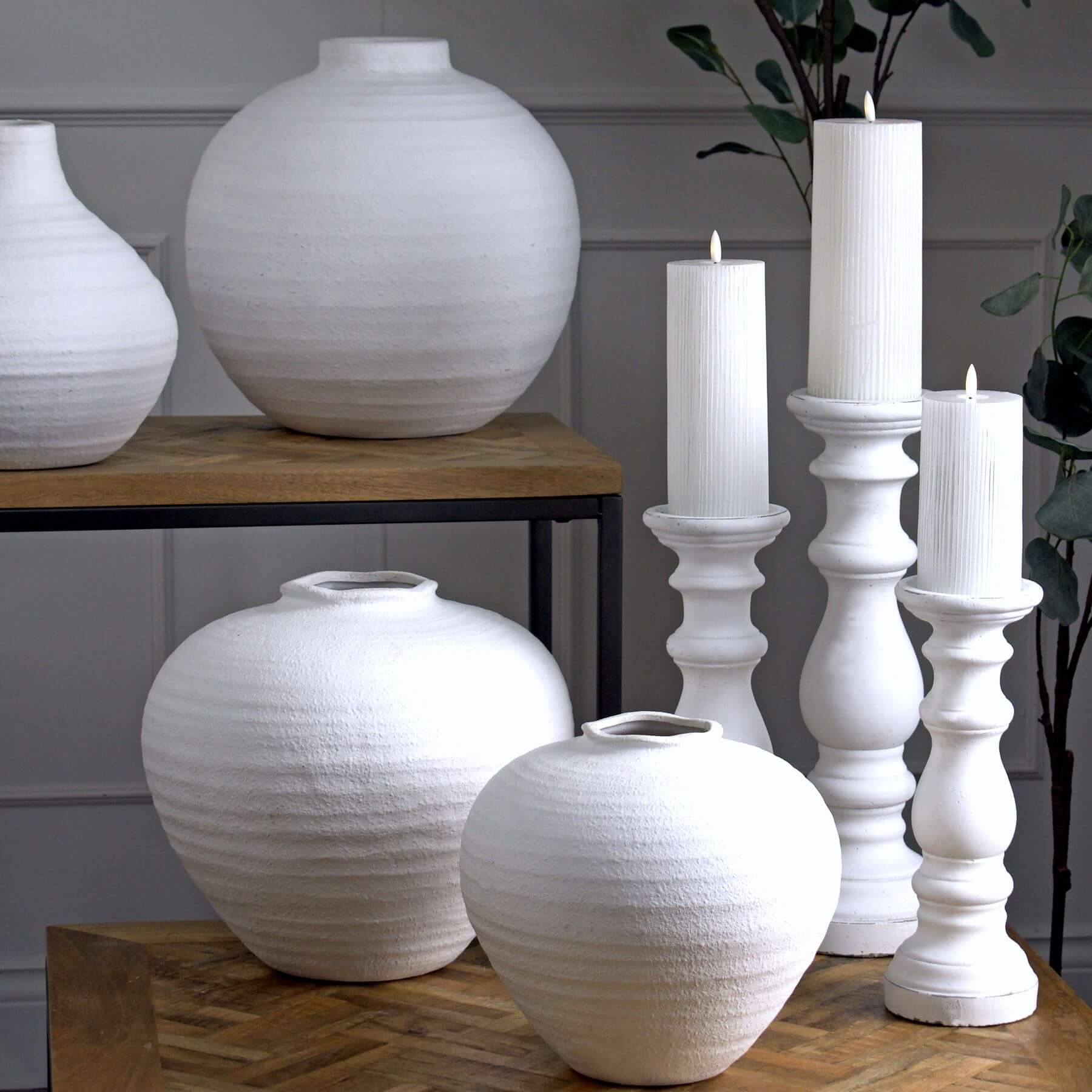 Sleek white ceramic column decor with minimalist design, perfect for modern interiors and candle displays. by RoomLondon at brixbailey.com