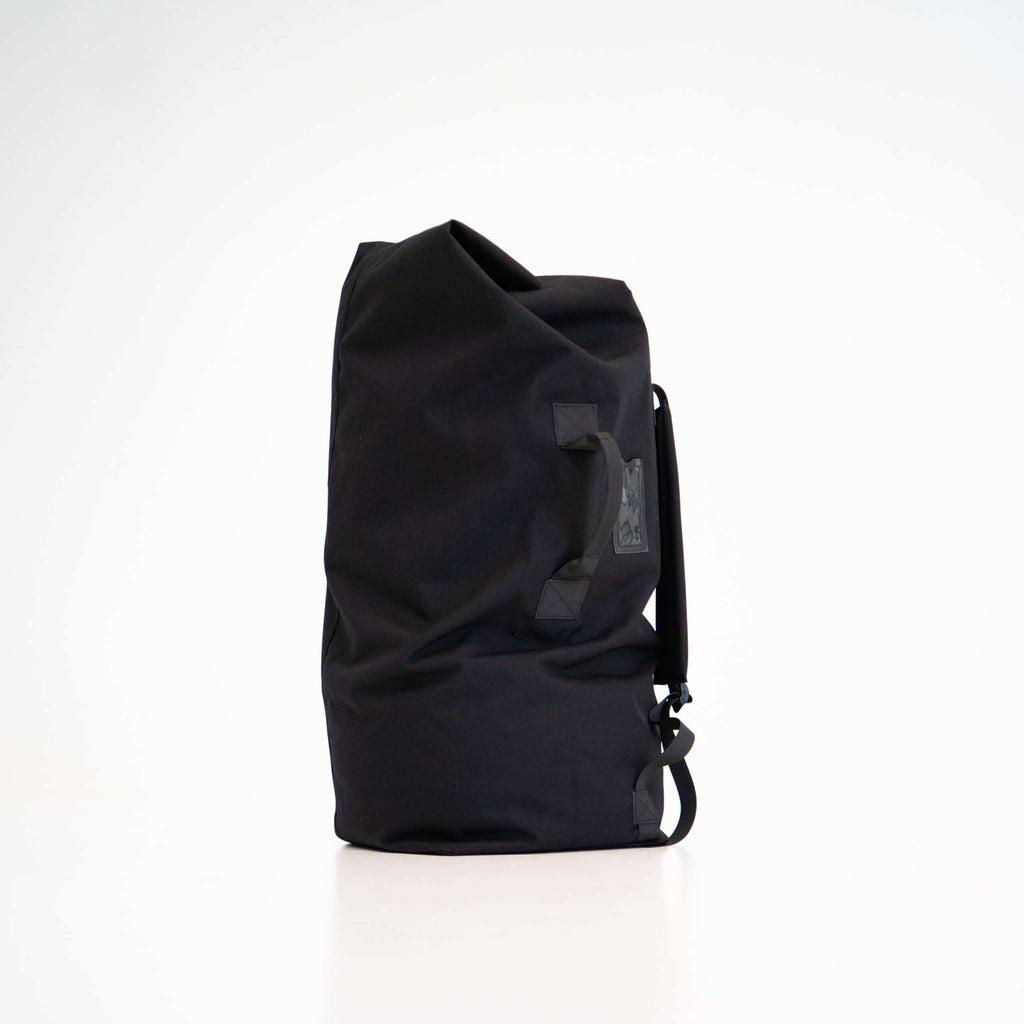 The Galvi-Linda black duffle bag 047 is made of durable polyester and features both shoulder straps and a handle for easy carrying—wear it on your back or carry it in your hand. The bag’s opening can be secured with a carabiner clip. It’s a spacious bag with plenty of room for all your essentials and even some non-essentials if needed. The bag is designed and made in Estonia. by Galvi Linda at www.brixbailey.com