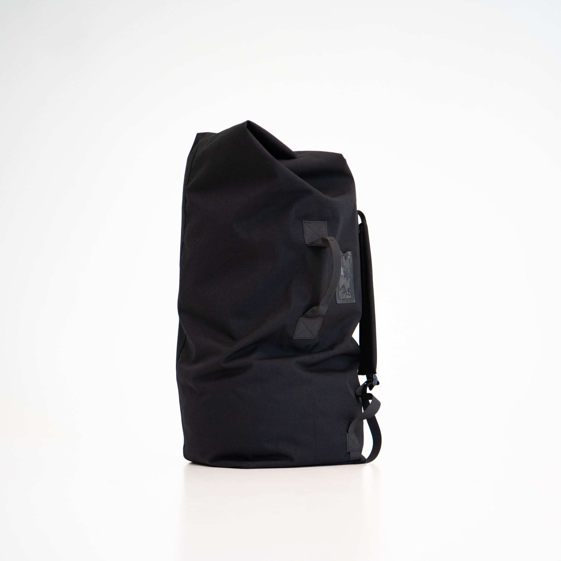 The Galvi-Linda black duffle bag 047 is made of durable polyester and features both shoulder straps and a handle for easy carrying—wear it on your back or carry it in your hand. The bag’s opening can be secured with a carabiner clip. It’s a spacious bag with plenty of room for all your essentials and even some non-essentials if needed. The bag is designed and made in Estonia. by Galvi Linda at www.brixbailey.com