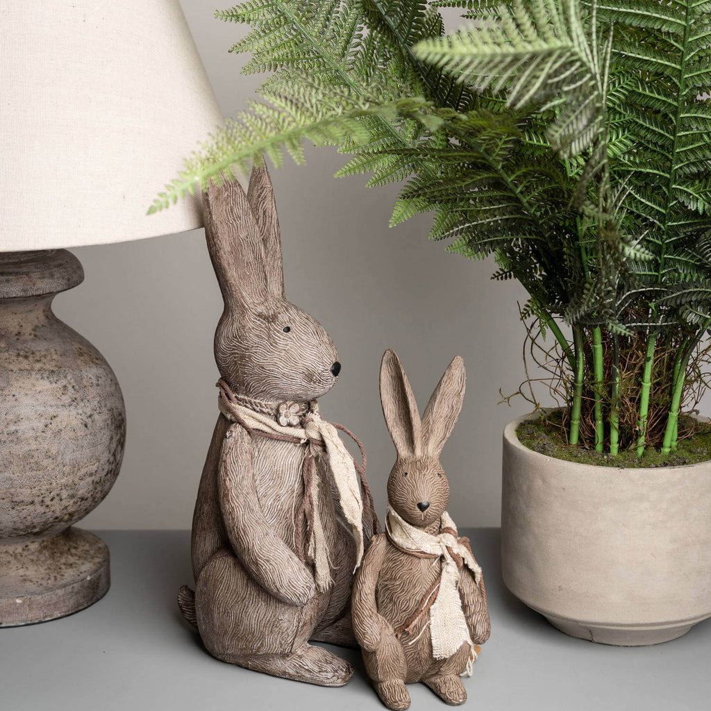 Handcrafted winter bunny rabbit resin figurine in warm brown, sitting pose with lifelike details, perfect for home decor. by Sostter at brixbailey.com