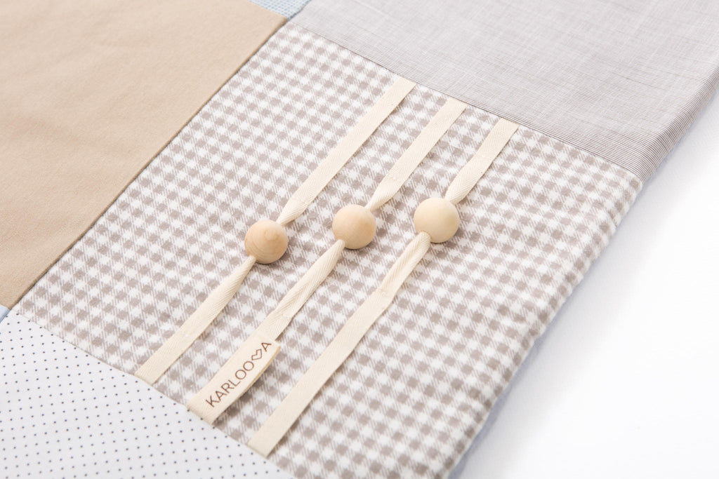 Handmade Baby Activity Mat with Starry Arch – Stimulates Vision & Motor Skills by Karloova at www.brixbailey.com