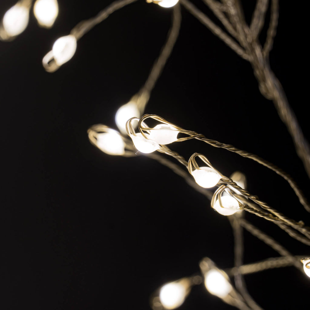 Warm white LED cluster string lights with 432 bulbs, silver wiring, and 8 lighting sequences for cozy ambiance.by Sostter at brixbailey.com