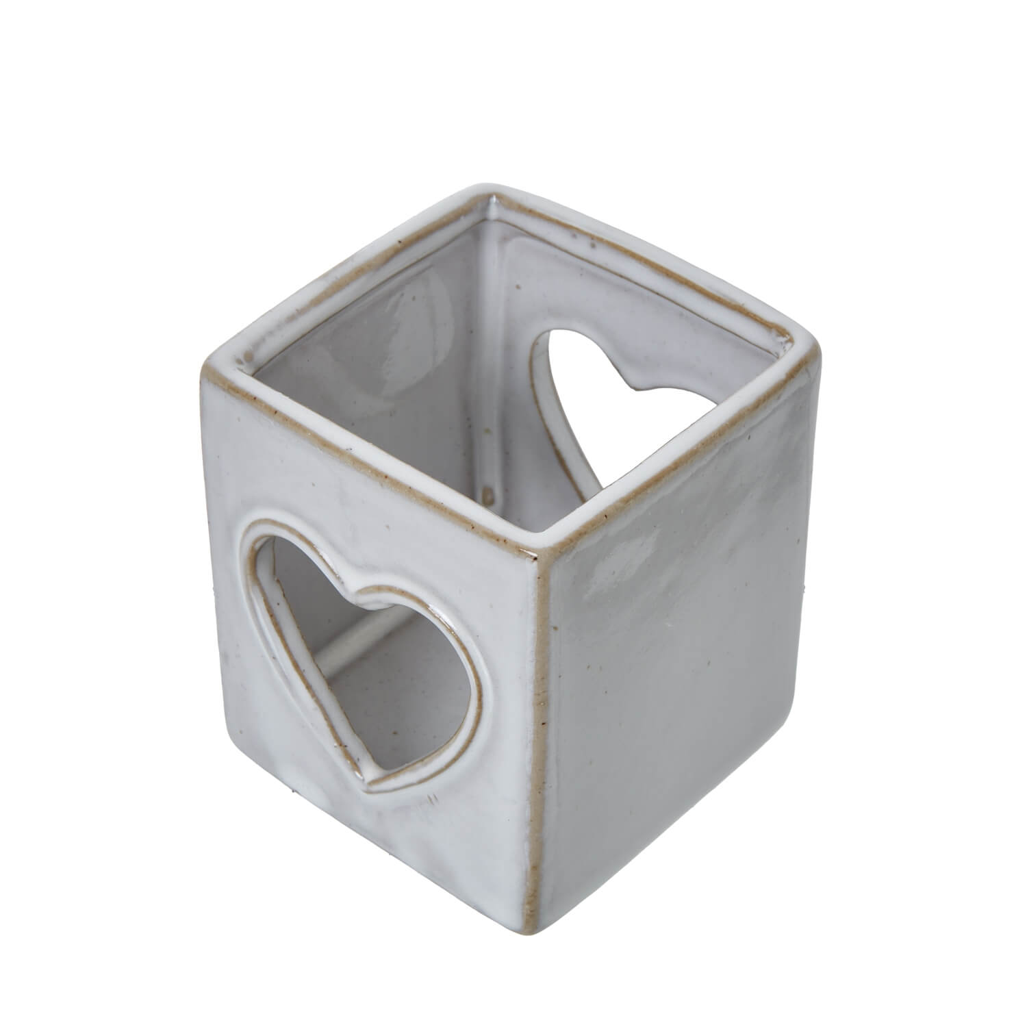 White ceramic tealight holder with heart cutout, Scandinavian minimalist design for ambient lighting by RoomLondon at brixbailey.com