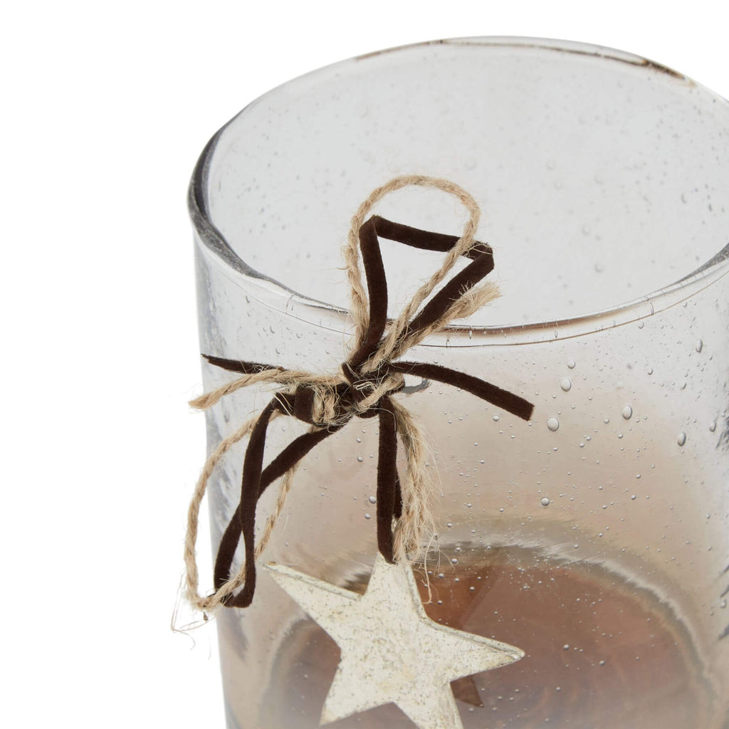 Handcrafted coffee ombre glass votive with floating star, twine bow, and gradient from clear to brown. by RoomLondon at brixbailey.com