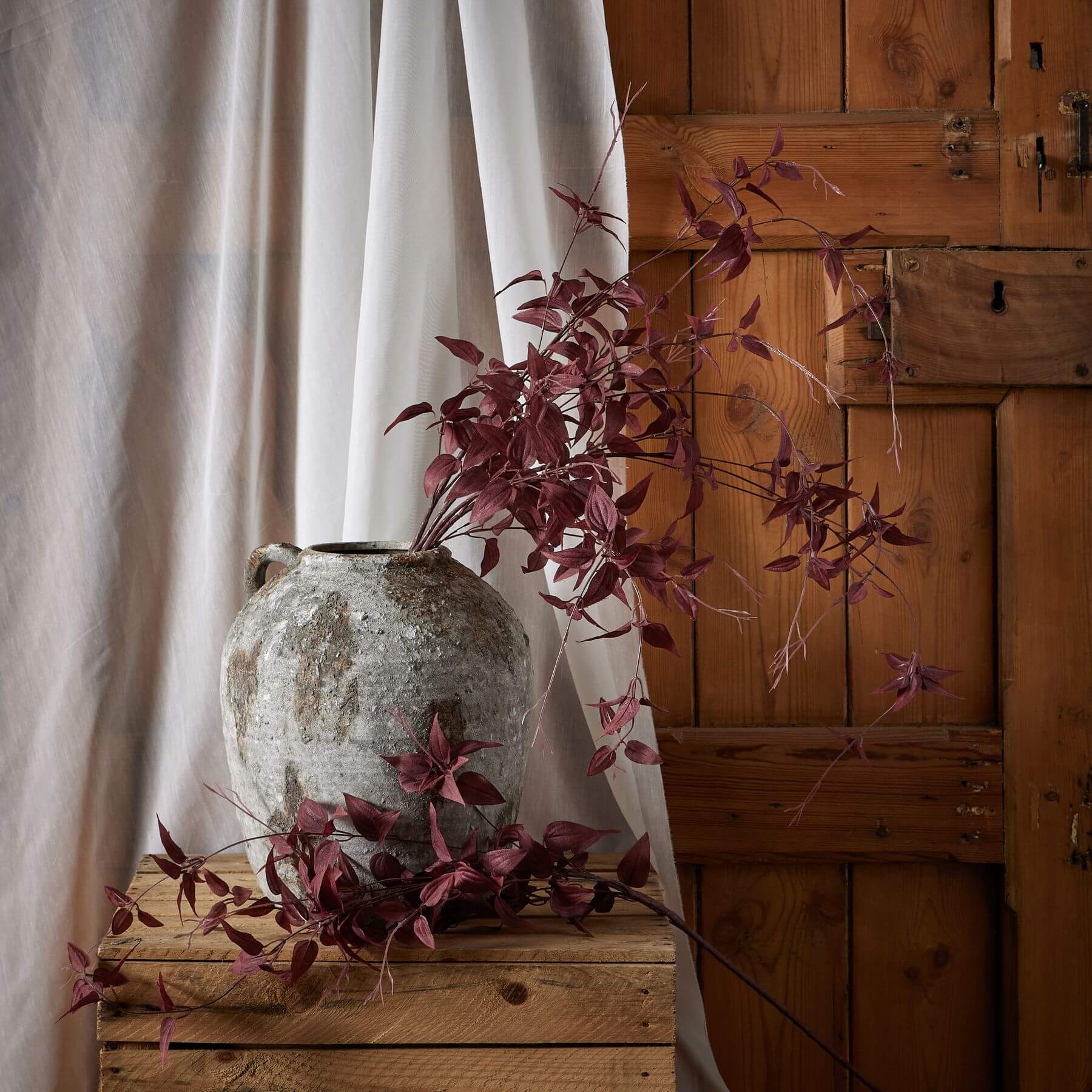 Burgundy plastic botanical stem with wispy tendrils, 88cm tall, for elegant floral arrangements and home decor by sostter at brixbailey.com