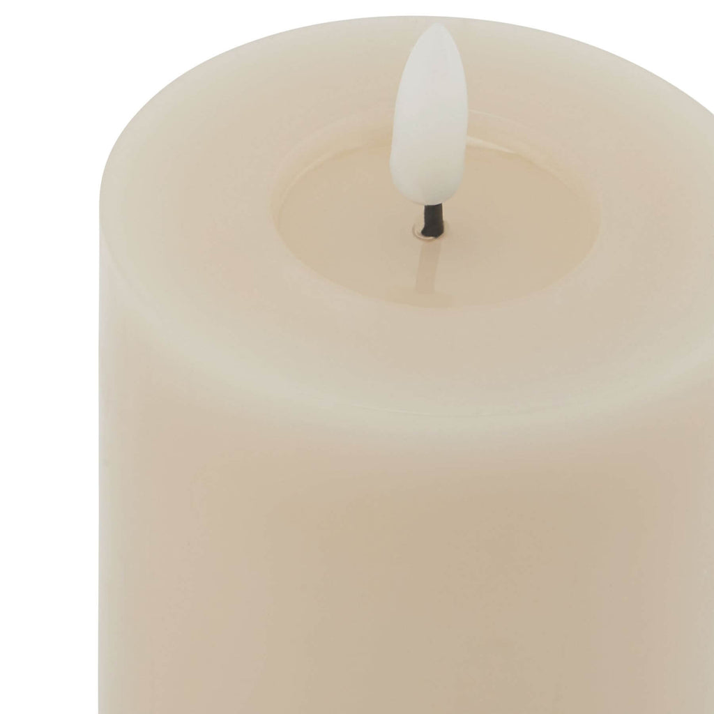 Taupe LED wax candle with realistic melt effect, flickering flame, and minimalist design for safe home ambiance by sostter at brixbailey.com
