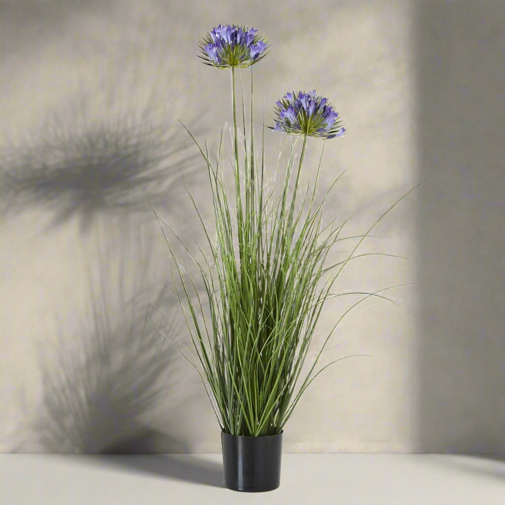 Lifelike artificial agapanthus arrangement with soft blue blooms and green stems in black pot, 90cm tall by sostter at brixbailey.com