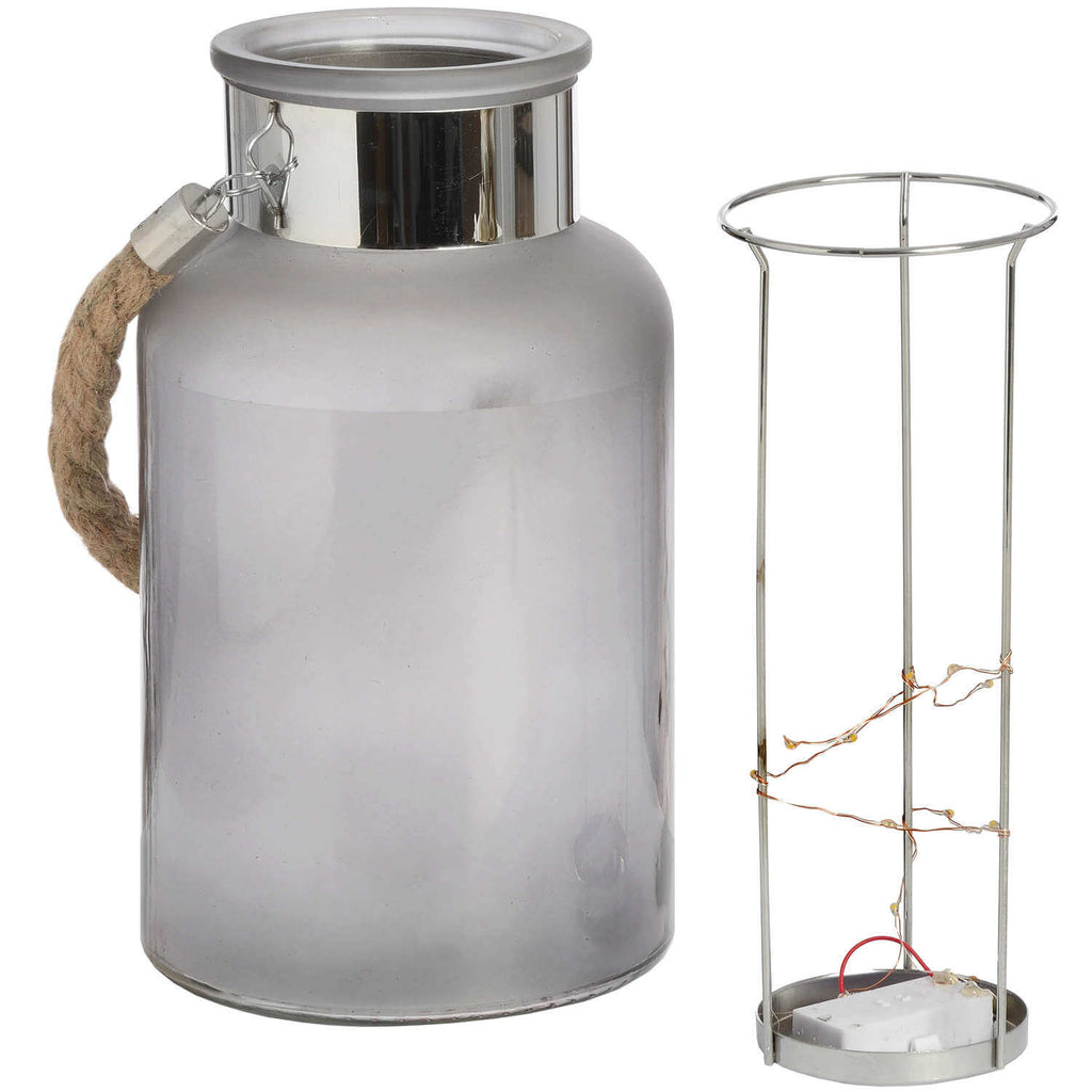 Frosted grey glass lantern with rope handle and LED lights, glowing starlight effect for indoor or outdoor ambiance. by RoomLondon at brixbailey.com