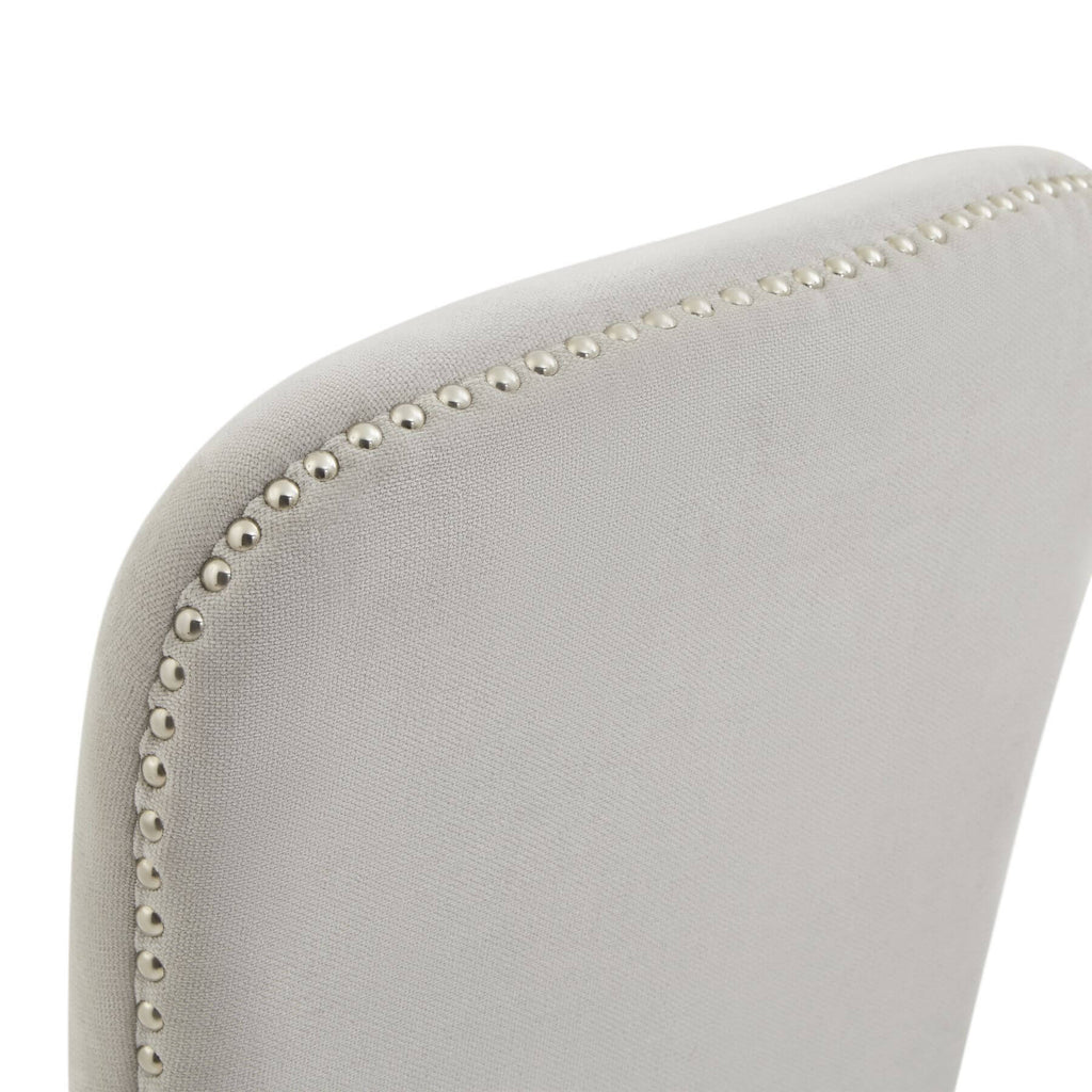 Cobham grey dining chair with padded seat, antique brass studs, and weathered oak frame in French provincial style by Sostter at brixbailey.com
