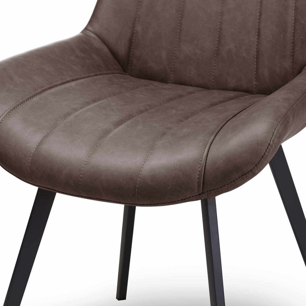 Malmo coffee brown faux leather dining chair with black metal legs and channel-stitched design by sostter at brixbailey.com