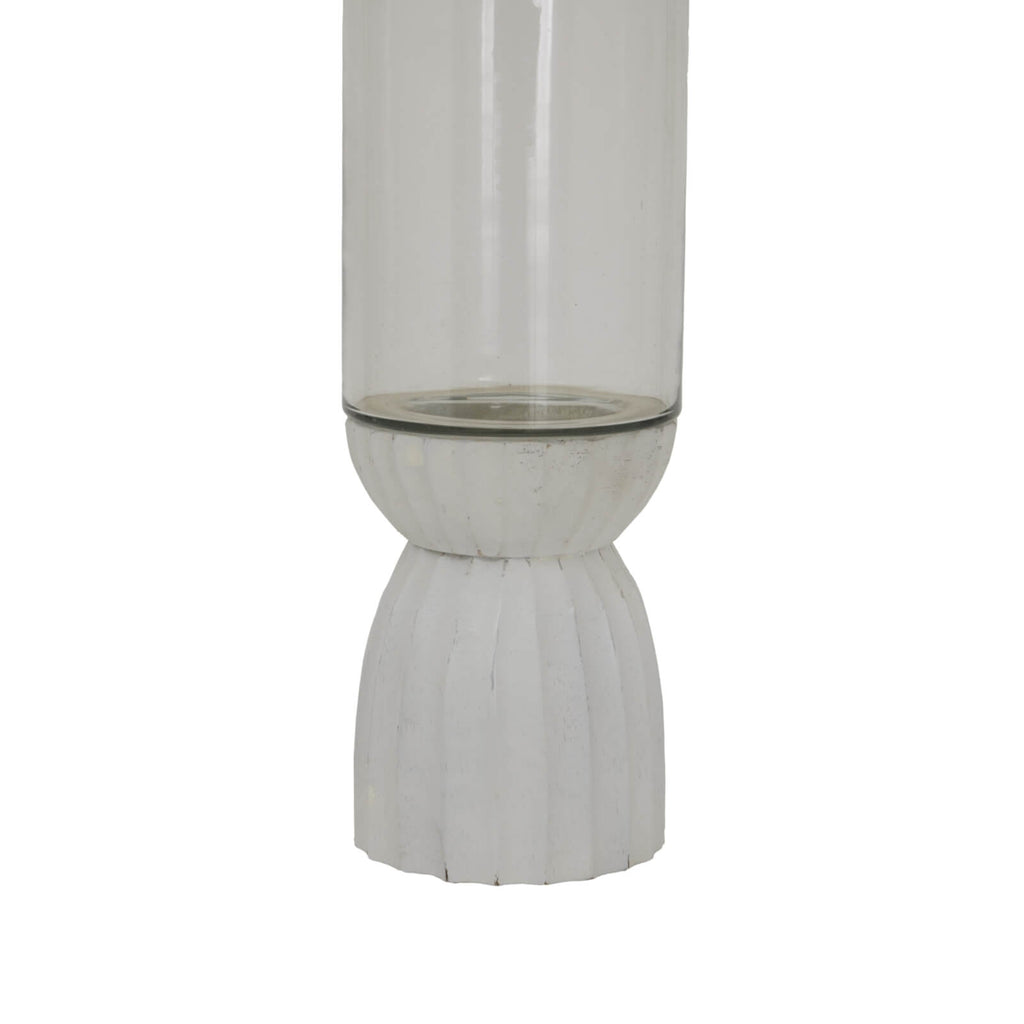 White carved glass hurricane lantern with intricate geometric patterns, warm atmospheric glow by RoomLondon at brixbailey.com