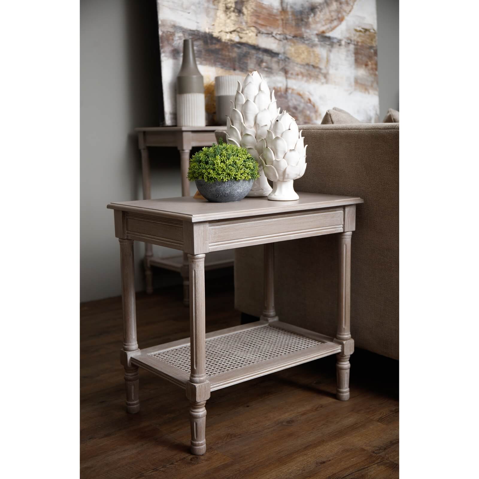 Handwoven rattan side table with tapered legs in soft grey, 60cm height, modern organic texture for coastal or minimalist decor by RoomLondon at brixbailey.com