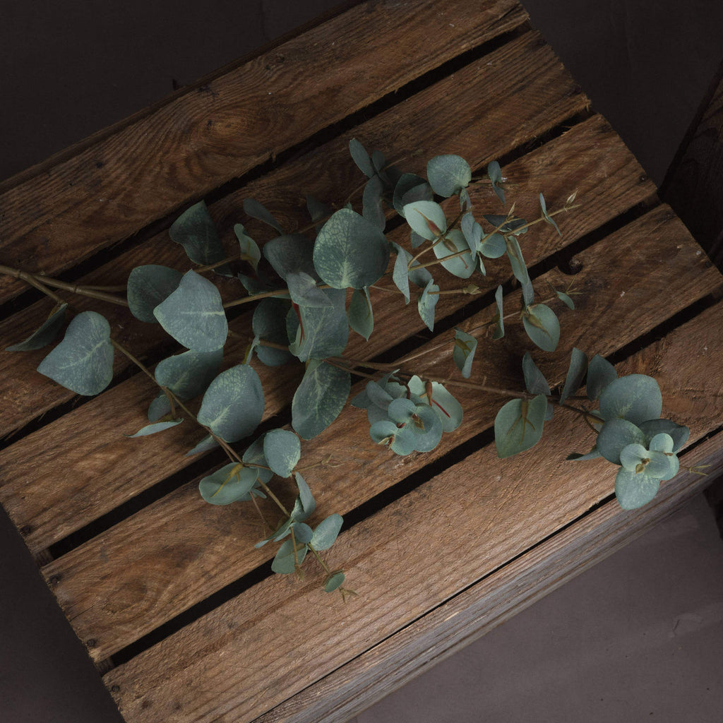 Lifelike variegated faux eucalyptus stem in sage green, handcrafted with realistic texture for home decor. by sostter at brixbailey.com