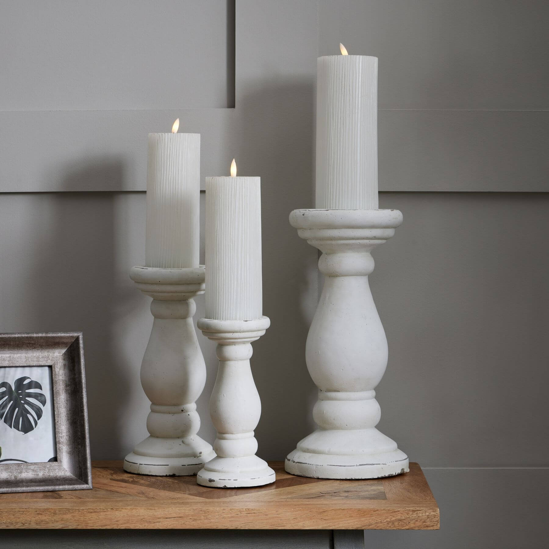 Handcrafted matte white ceramic candle holder with minimalist design, soft light diffusion, and elegant texture. by RoomLondon at brixbailey.com