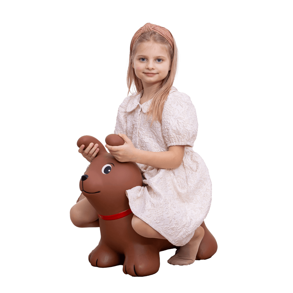 confident toddler bouncing high on a durable brown dog jumpy toy indoors