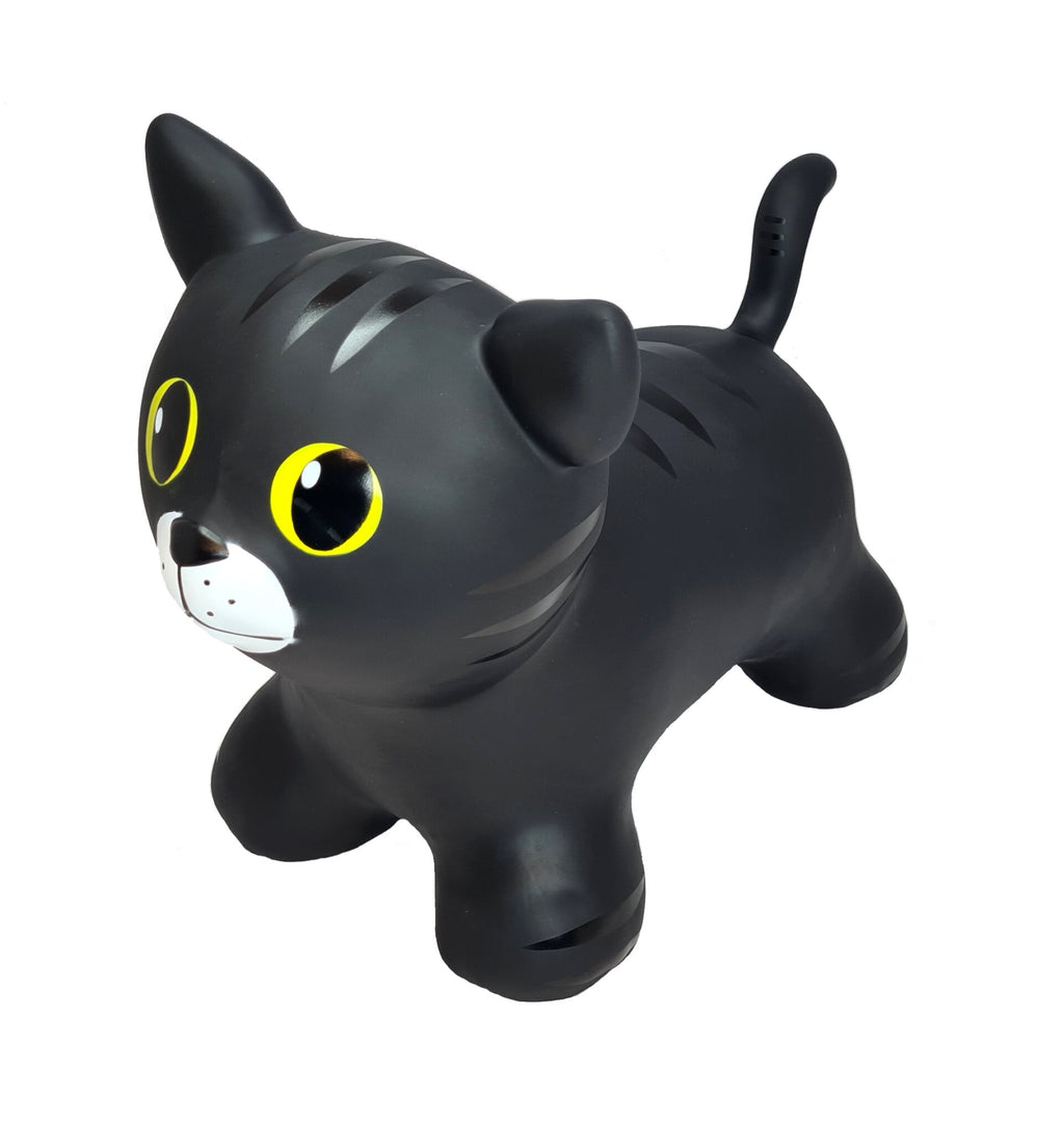 a toddler gleefully bouncing on a black cat jumpy toy in a sunlit playroom
