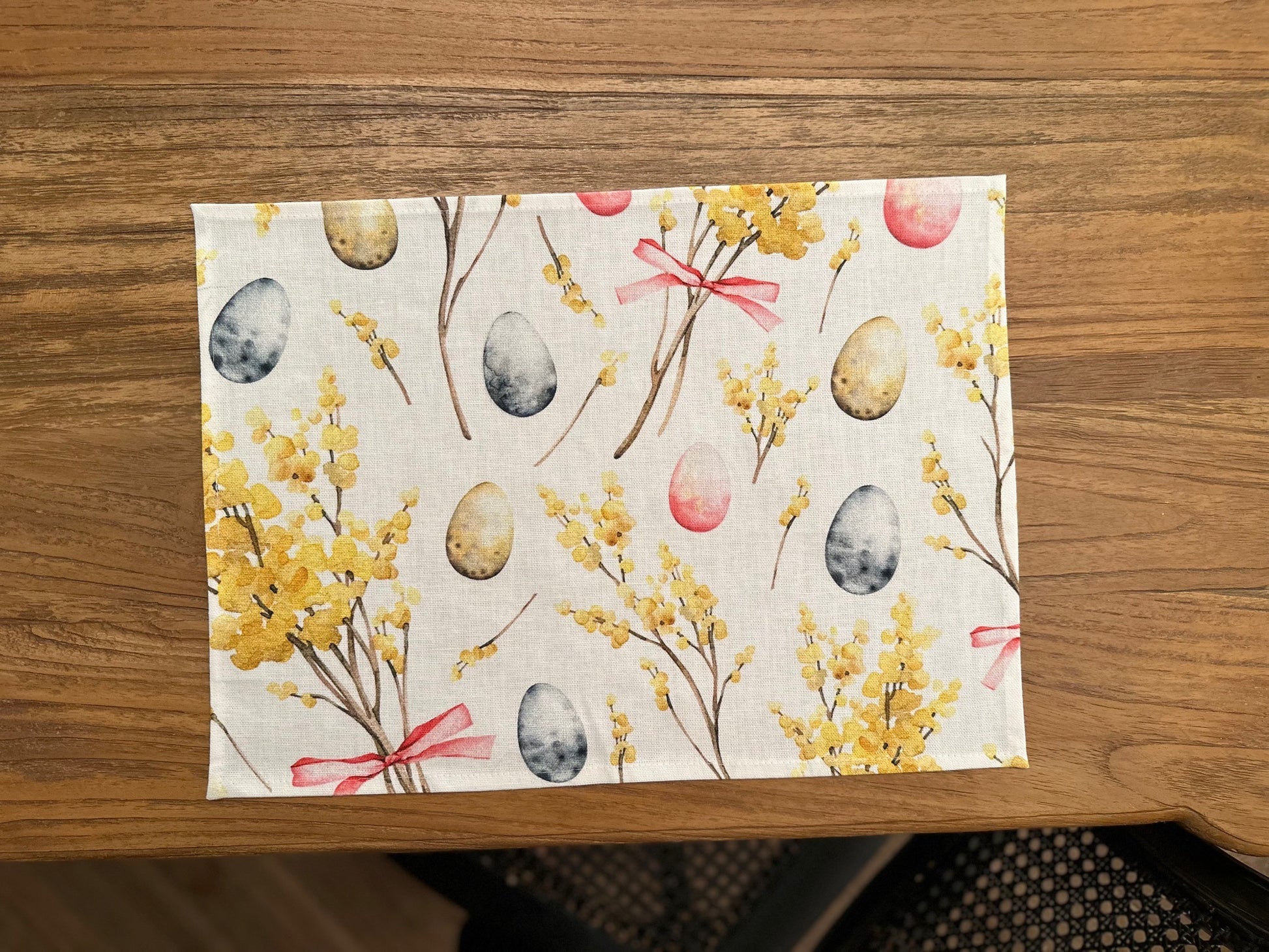 Elevate Your Dining Experience with the Easter Happy Placemat by Hortensias Home at www.brixbailey.com