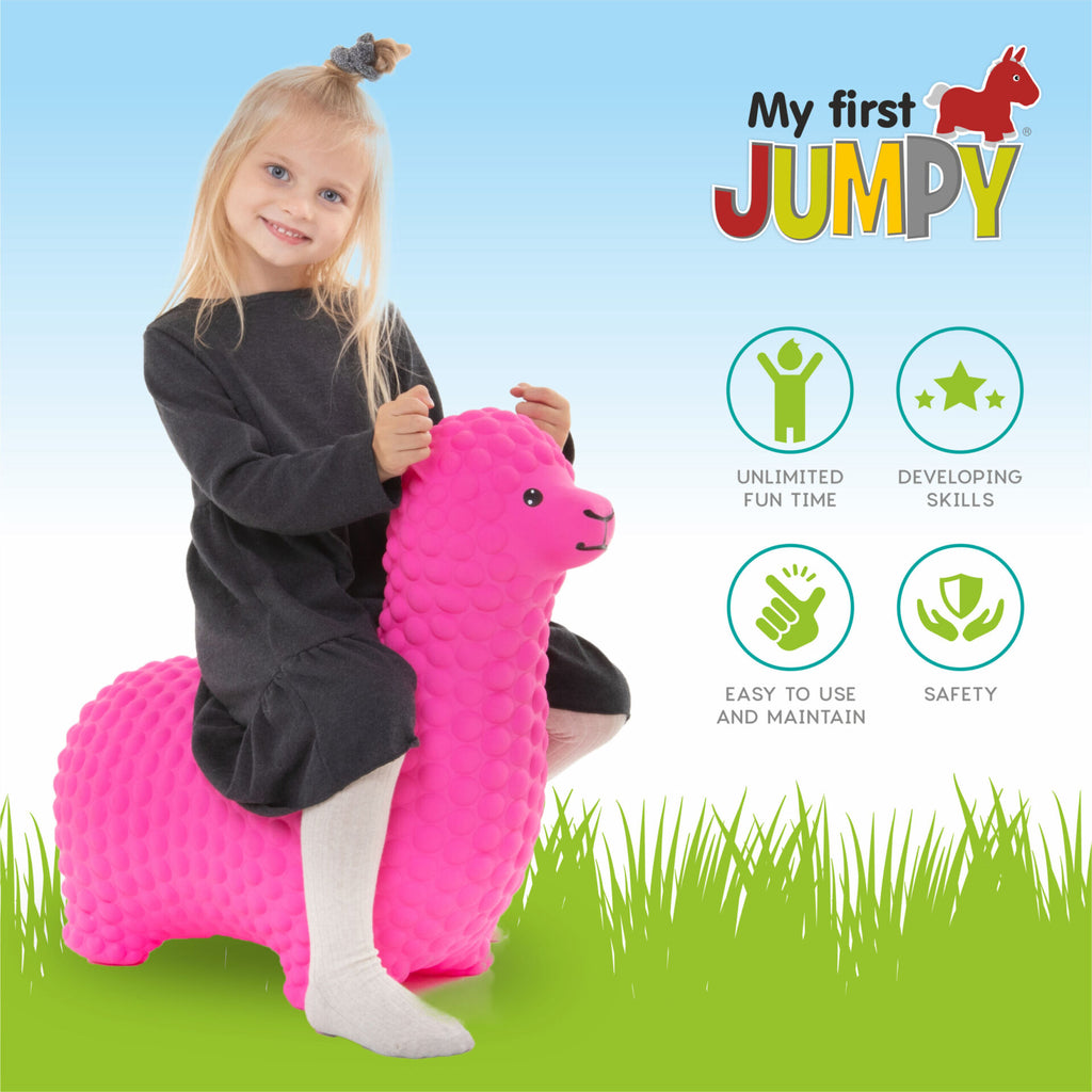 pink alpaca jumpy toy sitting on a soft rug in warm morning light
