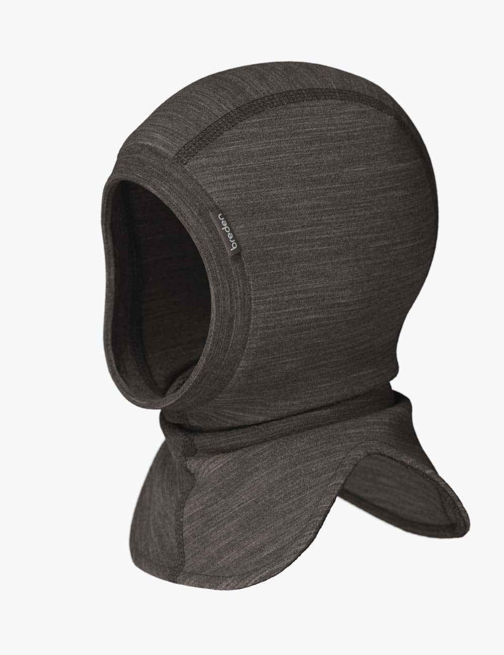 a playful baby giggling in a cozy merino wool balaclava mask during a winter adventure