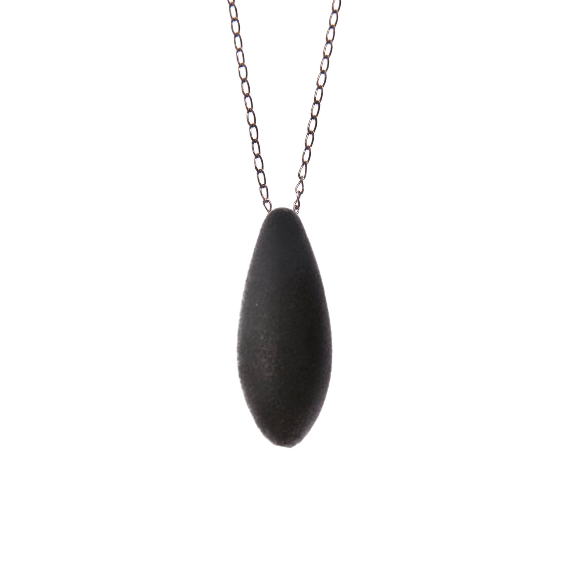 a bold close-up of the mini blackcurrant pendant with its cosmic dust sparkle
