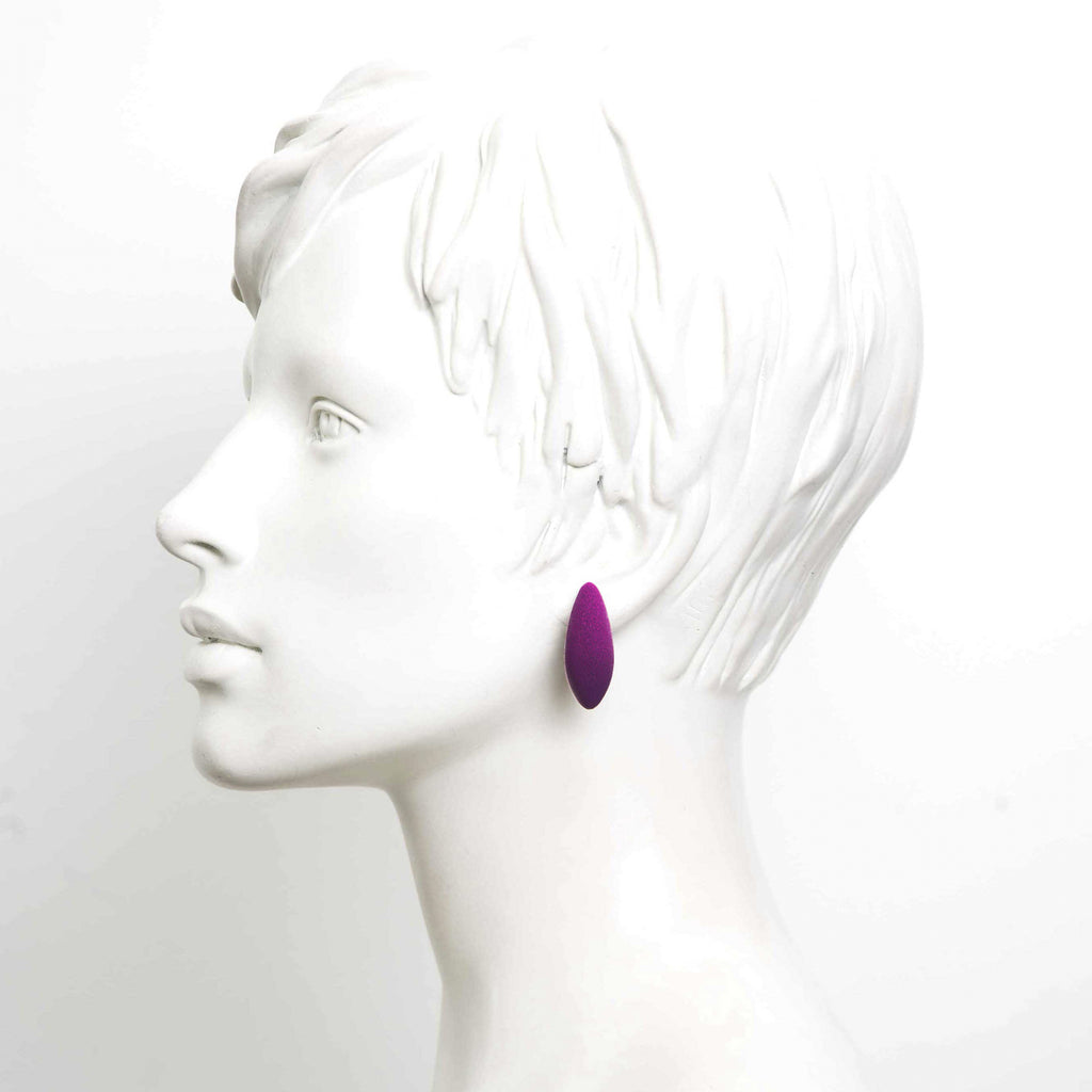 bold close-up of tanel veenre mini plums earrings with cosmic dust glow