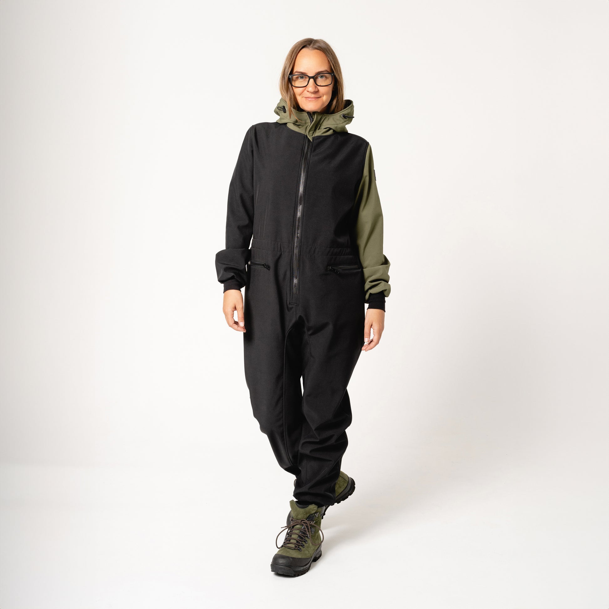 close-up detail of the carola softshell overall's durable waterproof zipper and estonian-made stitching