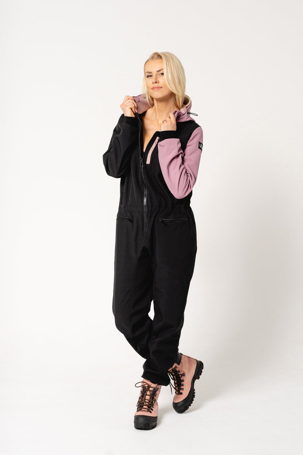 bold child in an eeva waterproof overall ready for a rainy adventure