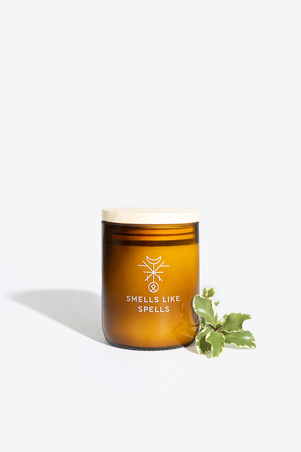 bold hero shot of mimir scented candle in amber glass, radiating tranquility with lavender, sandalwood, and opium