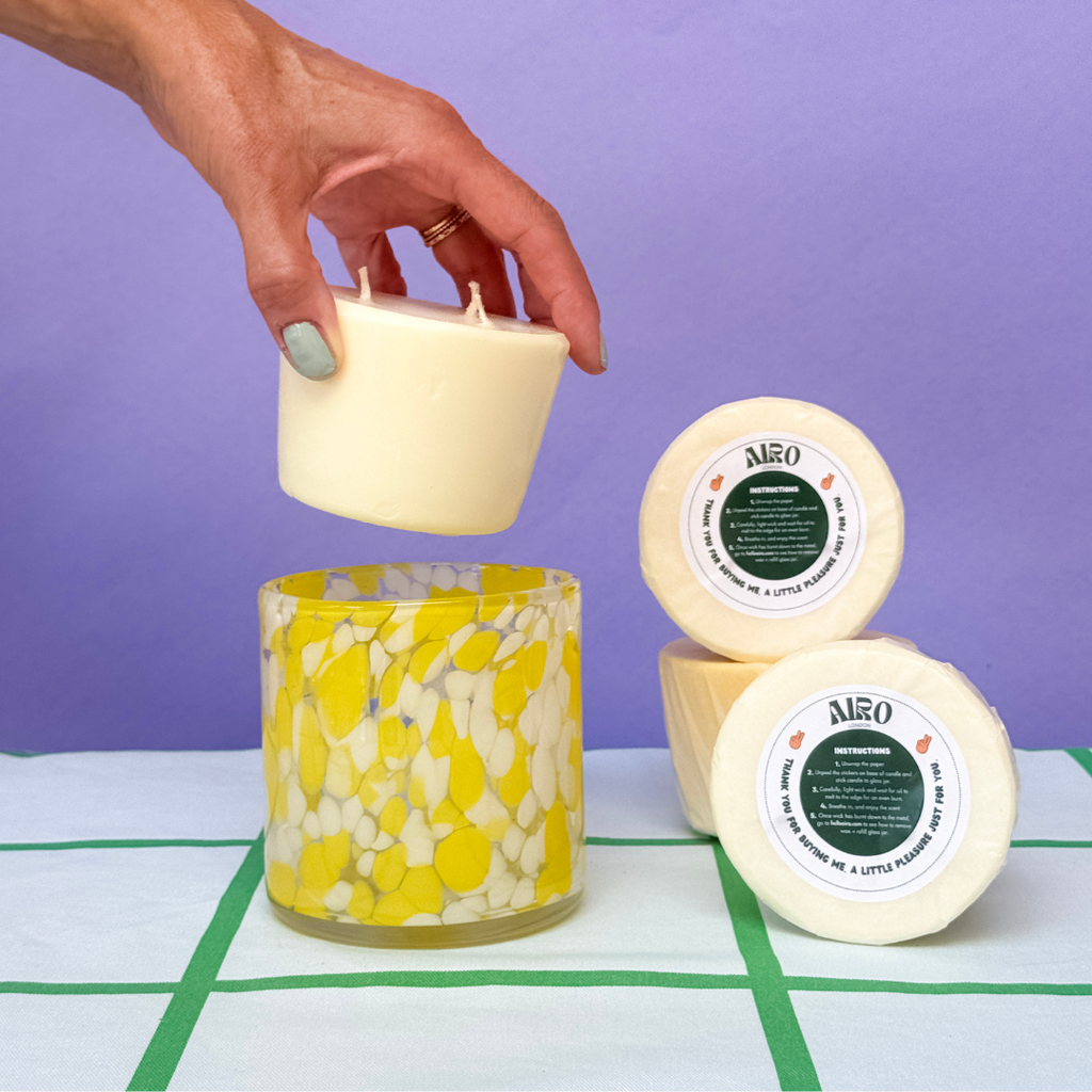 Candle with decorative stones and two Airo soap bars by independent aromoatheroapy and candle brand Airo London at Sostter