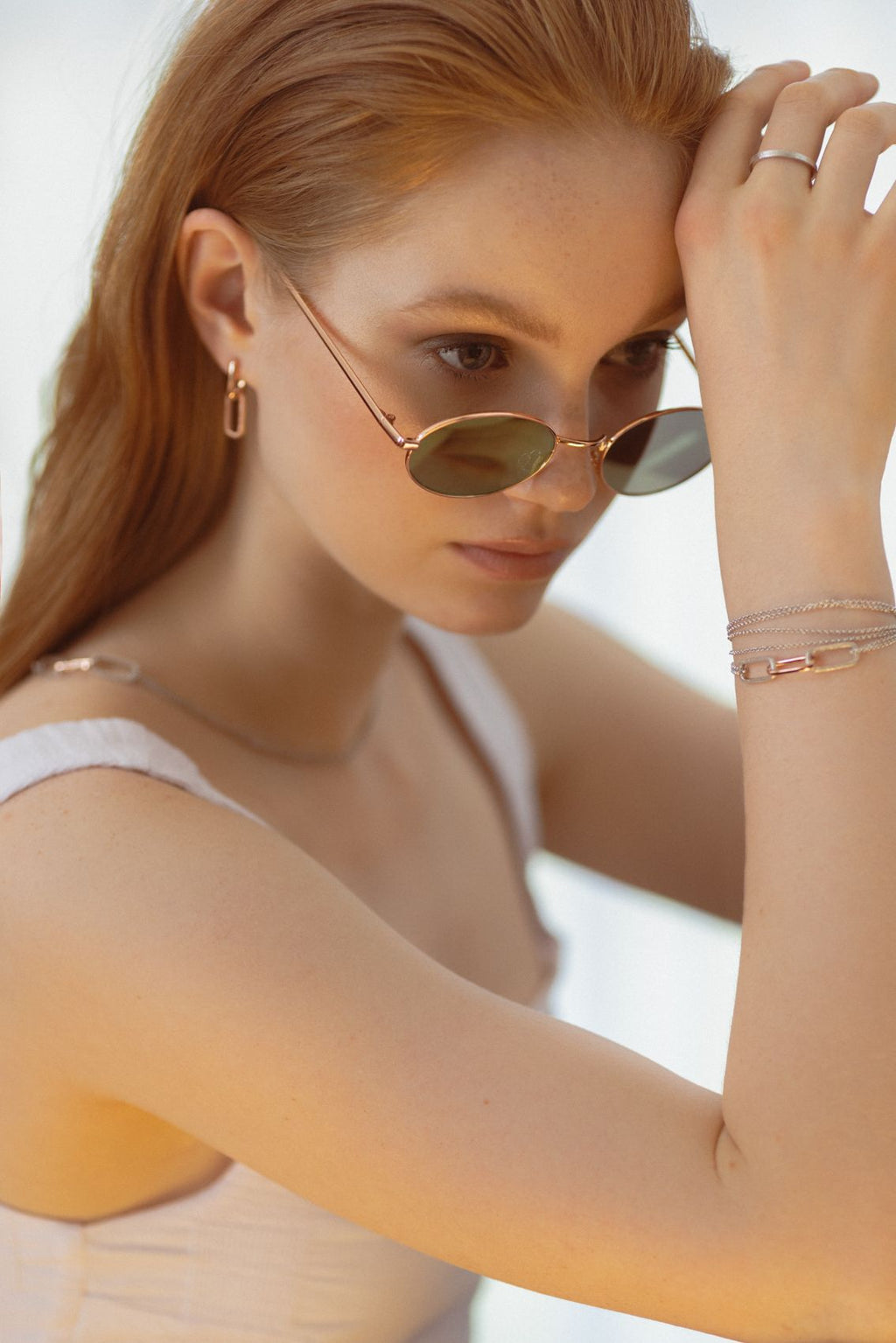 soft rose gold metropolitan earrings resting on a velvet surface, a comforting and elegant gift