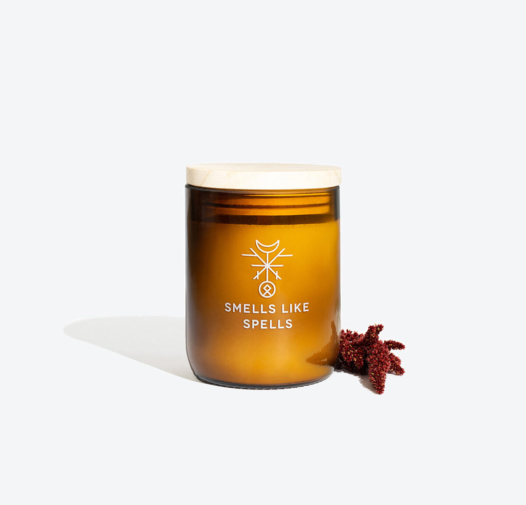 playful flicker of freyr's fortune candle with amber jar casting warm, inviting light for prosperity