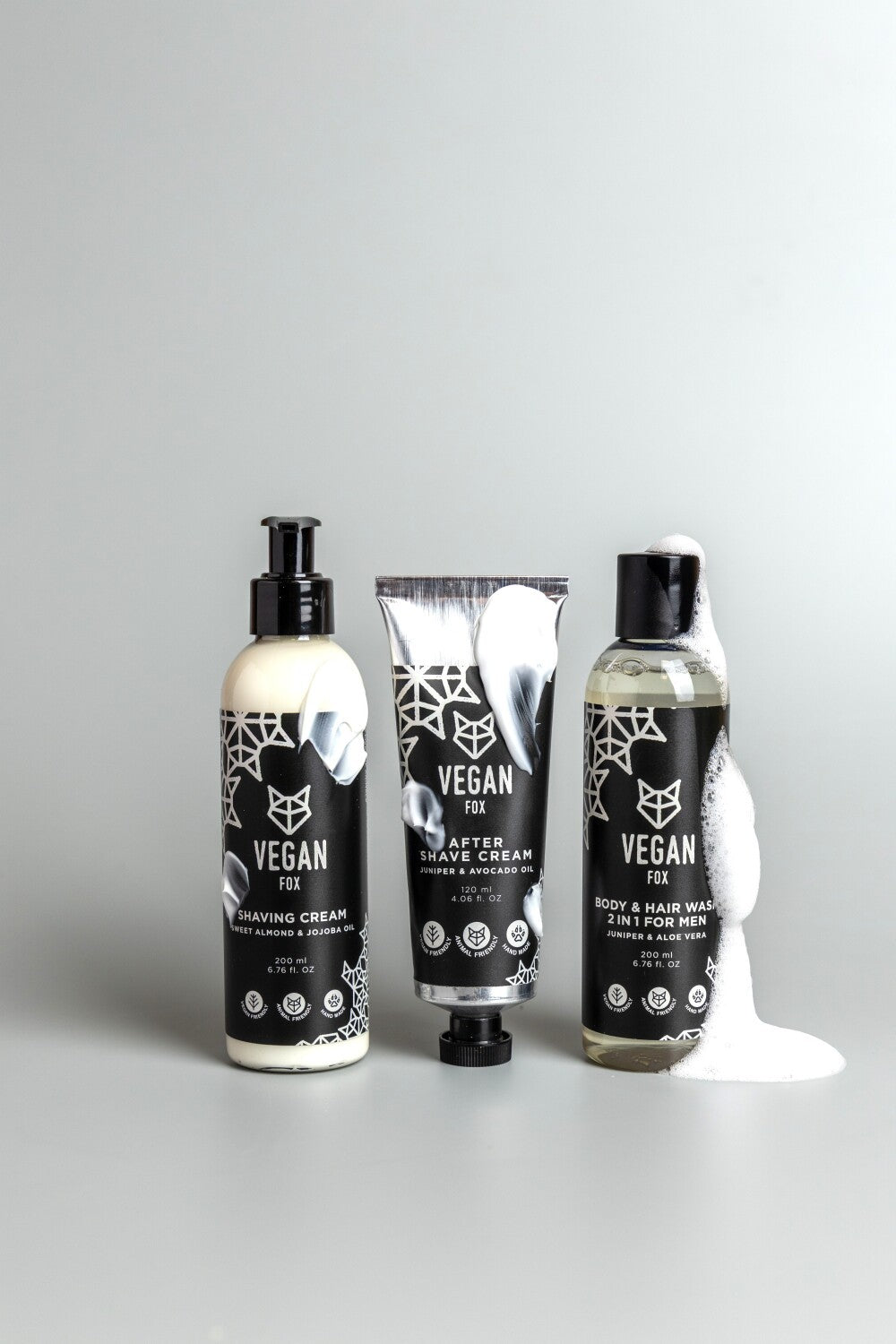 elegant men's grooming set with shaving cream and after shave on a minimalist marble surface