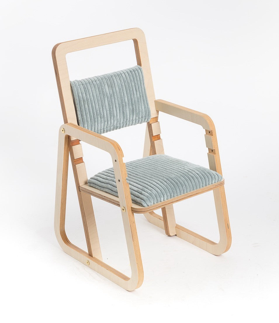 bold mint green julle kids chair with wide stable legs and plush padding