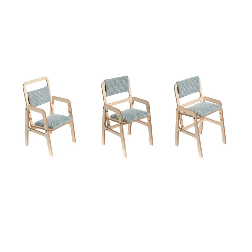 a soft mint green kids chair with gentle natural wood grain and plush back padding