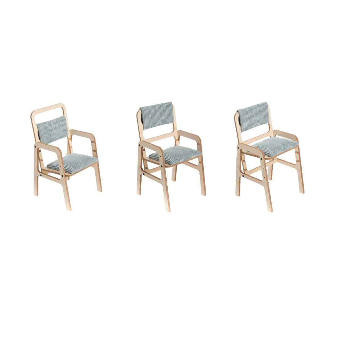 a soft mint green kids chair with gentle natural wood grain and plush back padding