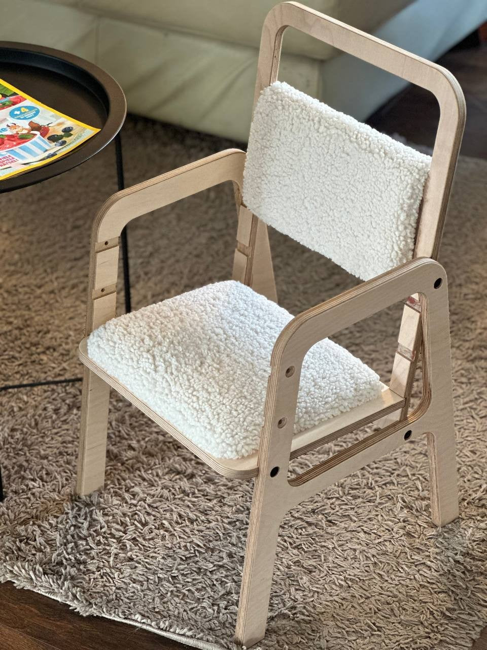 elegant luula vanilla lamb kids chair in a refined nursery setting