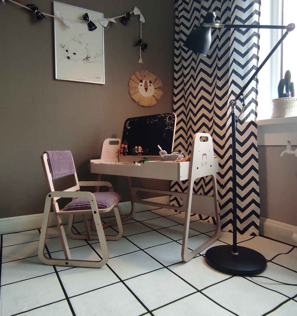 elegant cannon pink montessori table and chair set with natural wood edges in a refined nursery setting