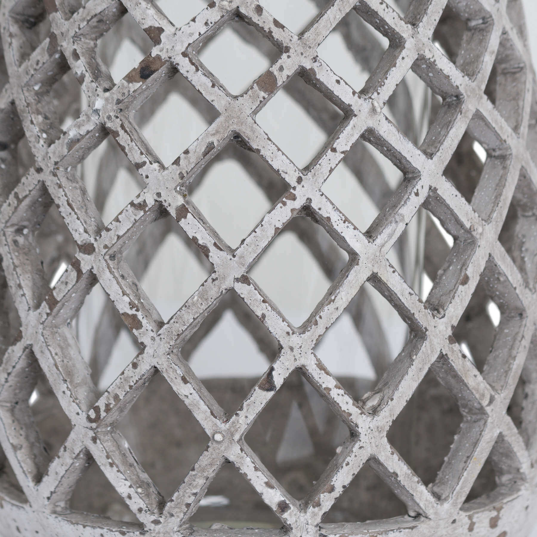 Large conical ceramic lattice hurricane lantern in natural stone, elegant lattice cutouts for soft ambient lighting by RoomLondon at brixbailey.com
