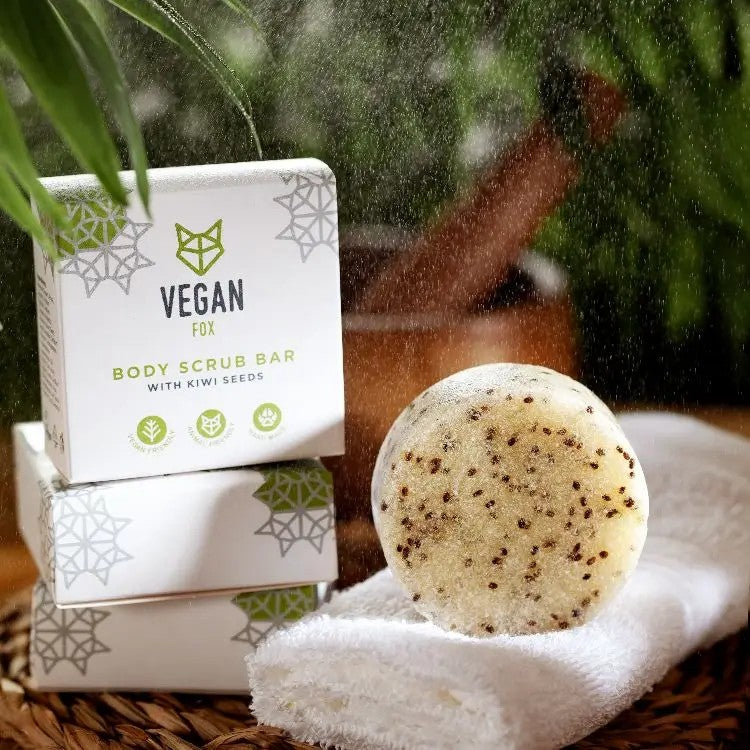 bold close-up of kiwi seed scrub bar with visible exfoliants and lemongrass scent