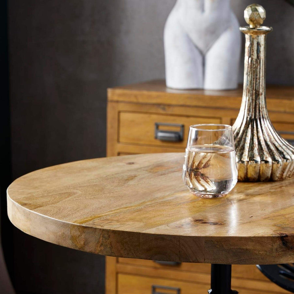 Adjustable industrial bistro table with weathered wood top and black metal frame, perfect for dining or entertaining. by sostter at brixbailey.com