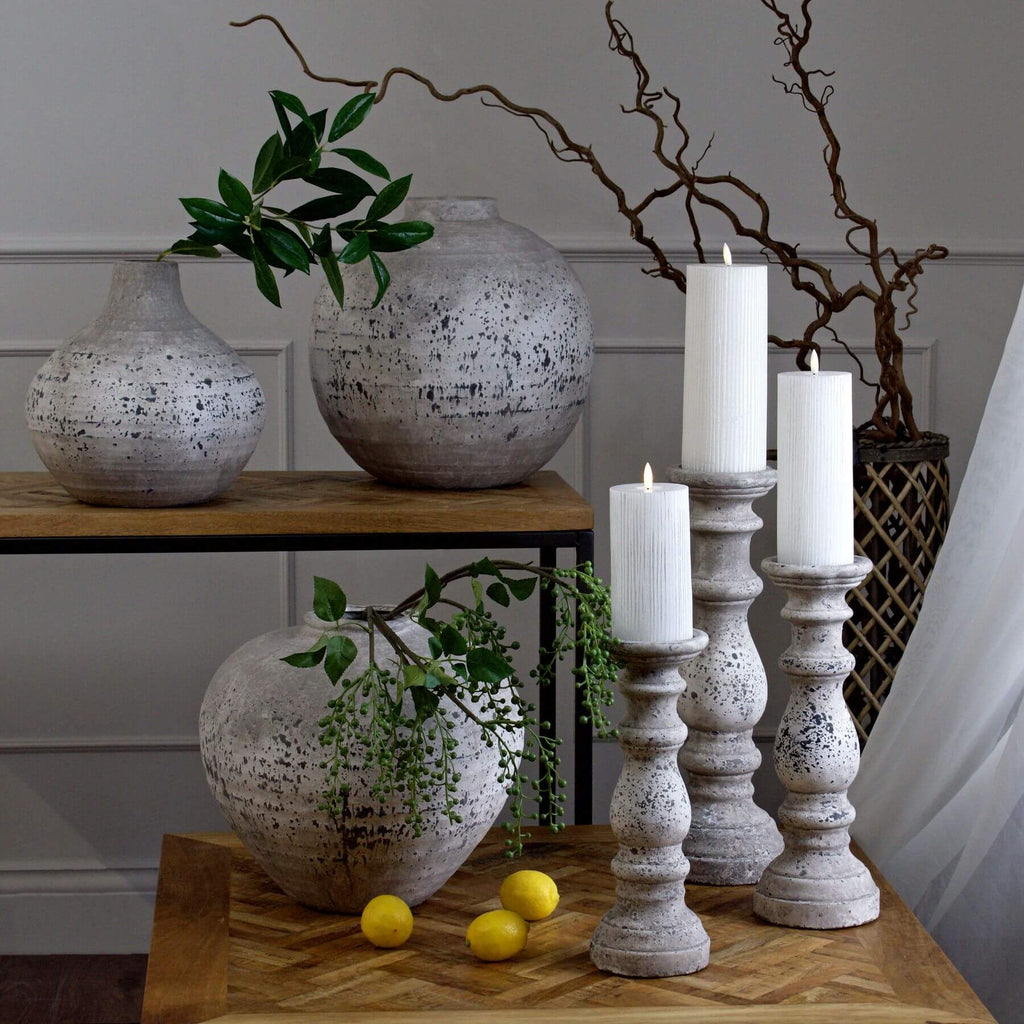 Stone ceramic column candle holder with Greco-Roman design in neutral matte finish, 38cm tall by RoomLondon at brixbailey.com