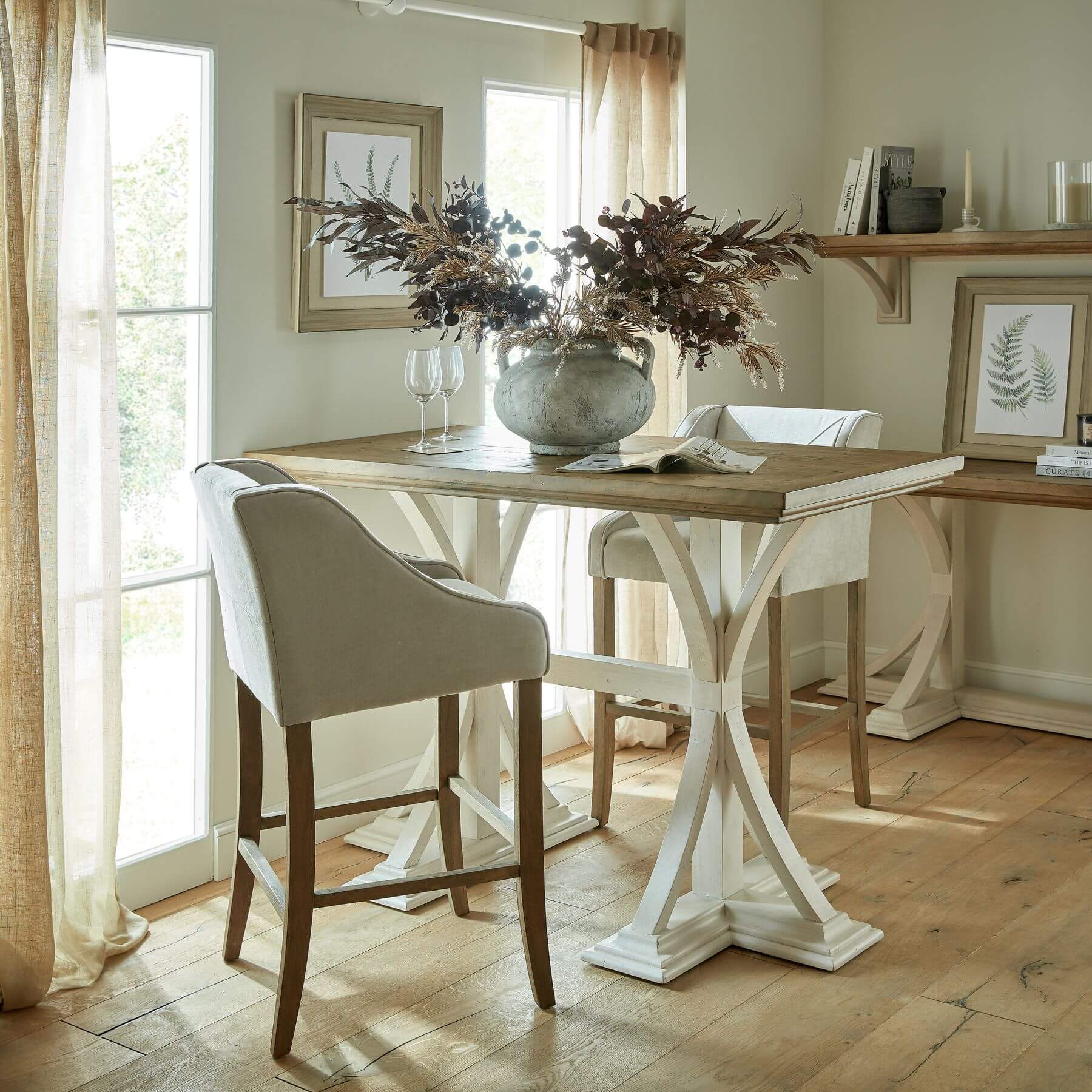 Handcrafted pine bar table with rich wood grain and white base, rustic-modern style for dining or entertaining. by RoomLondon at brixbailey.com
