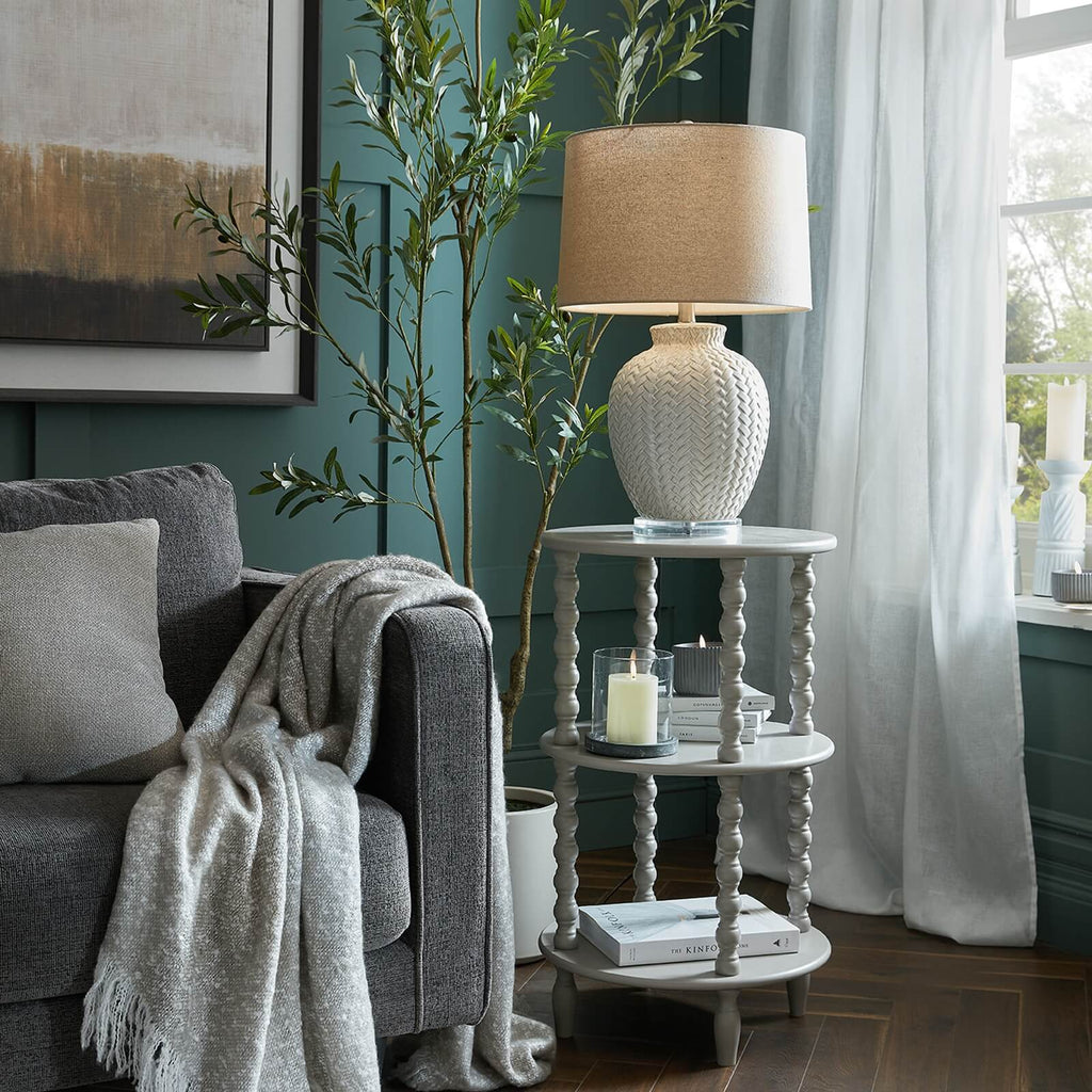 Modern round side table in warm grey wood, 76cm height, minimalist design with organic curves by Sostter at brixbailey.com