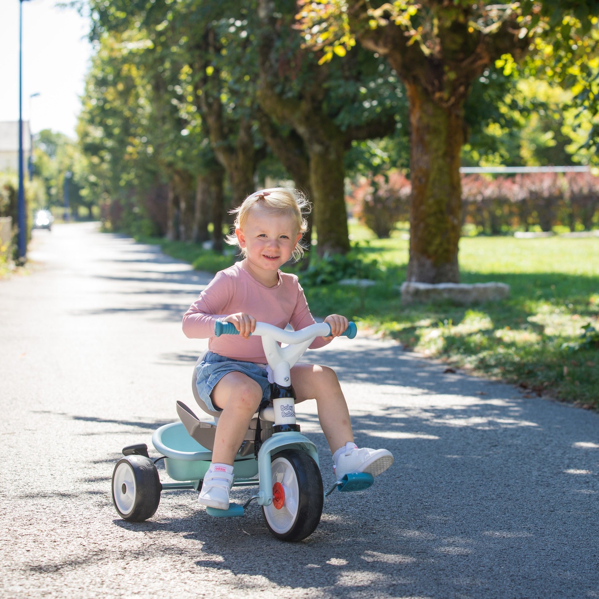 bold blue baby balade plus tricycle with parent handle and sun visor for confident family adventures